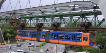 Wuppertaler Schwebebahn Floats Over An Intersection